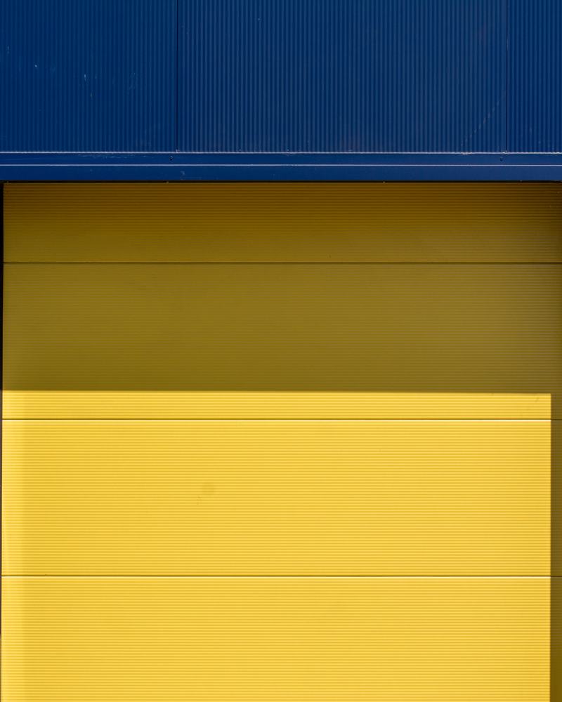 Yellow loading-bay door on a blue building